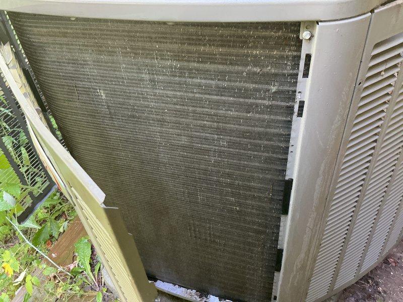 Completed annual air conditioning tune-up on a 3-year-old outdoor condensing unit. Upon inspection, found heavy accumulation of dirt, dust, and debris on condenser coils significantly reducing heat transfer efficiency. Thoroughly cleaned condenser coils to restore proper airflow and system performance. Verified unit operation, checked refrigerant levels, inspected electrical connections, and confirmed all components functioning within normal parameters. System restored to optimal cooling capacity for continued reliable operation.