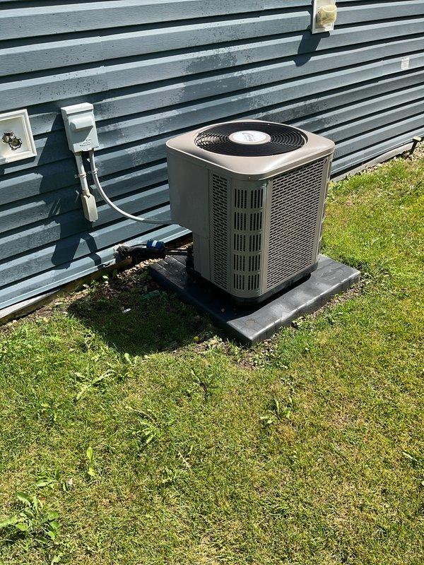 Completed recurring maintenance service on residential air conditioning system. Unit was found in good operating condition with clean condenser coils, proper electrical connections, and secure mounting on concrete pad. Performed standard preventive maintenance procedures and verified system functionality, restoring cooling operation to normal parameters.