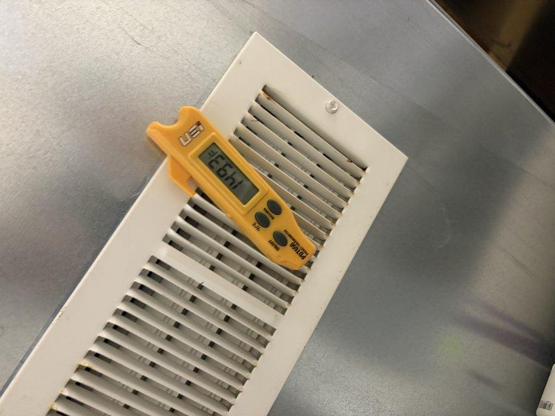 Completed comprehensive gas furnace tune-up and performance evaluation, including temperature differential measurements at supply ductwork (-18.1°F reading indicated) and register airflow verification. Filled out required city certification documentation and assessed water heater condition, recommending flushing based on visual inspection and age of unit.