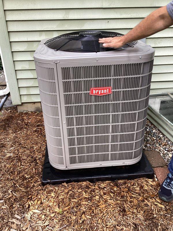 Completed annual air conditioning tune-up on Bryant outdoor condensing unit. Performed comprehensive system inspection, verified unit operation, and documented equipment condition with photos showing proper installation on pad with adequate clearance. Membership was reactivated and follow-up service appointment scheduled.