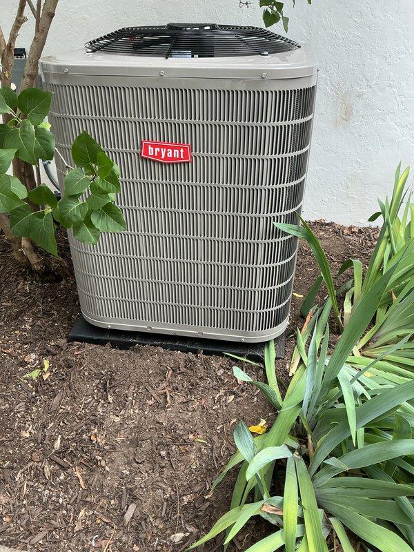 Completed full HVAC system installation including outdoor Bryant condensing unit and indoor air handler with evaporator coil. The outdoor condenser was positioned on a composite pad against the building exterior with appropriate clearances maintained for airflow and serviceability. Inside the attic space, installed air handler and coil assembly on a reinforced plywood platform with proper structural support. Ran and secured insulated refrigerant linesets between outdoor and indoor units, ensuring proper pitch for oil return. Connected PVC condensate drain lines with trap installation to prevent airflow issues and ensure proper drainage. Installed flexible supply ductwork with spiral wire reinforcement, routing through attic space to existing distribution points. Made all electrical connections per manufacturer specifications and local code requirements. Evacuated refrigerant lines to remove moisture and non-condensables, then charged system to nameplate specifications. Verified proper 