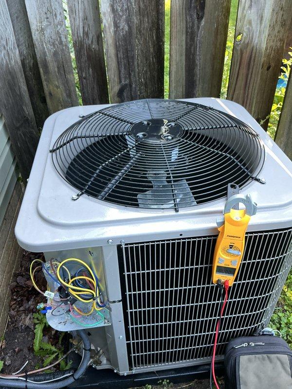 Completed comprehensive air conditioning tune-up on newer residential condensing unit. Performed electrical diagnostics using digital multimeter, verified proper voltage and amperage readings at compressor and fan motor, and inspected all electrical connections within unit's control panel. System operating within manufacturer specifications with no deficiencies noted.