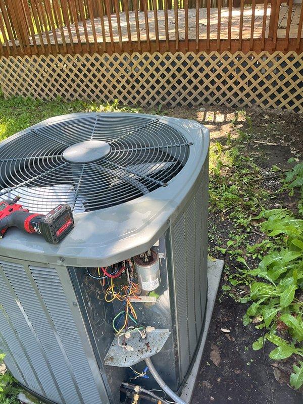 Completed comprehensive AC tune-up on outdoor condensing unit. Performed full system inspection with access panel removal to examine internal components including capacitor, refrigerant lines, and electrical connections. Cleaned accumulated dirt and debris from internal compartment, verified proper operation of condenser fan, and ensured all connections were secure and functioning within manufacturer specifications.