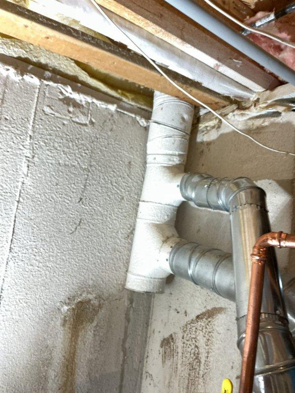 Completed installation of new water heater in basement utility room with proper expansion tank and copper supply line connections. Installed associated PVC drainage and venting system with multiple fittings to ensure proper code compliance and safe operation. All plumbing connections were tested and verified for proper function prior to completion.