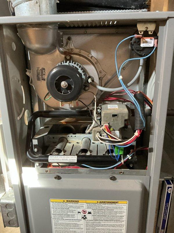 Completed comprehensive tune-up and maintenance service on gas furnace and air conditioning system. Performed thorough inspection of furnace internal components including blower motor assembly, electrical connections, and control board wiring. Conducted combustion analysis using Testo 300 flue gas analyzer to verify proper gas combustion efficiency and safety parameters, with readings indicating satisfactory operation within normal temperature ranges. All electrical connections, wire bundles, and safety controls were inspected and found to be in functional condition.