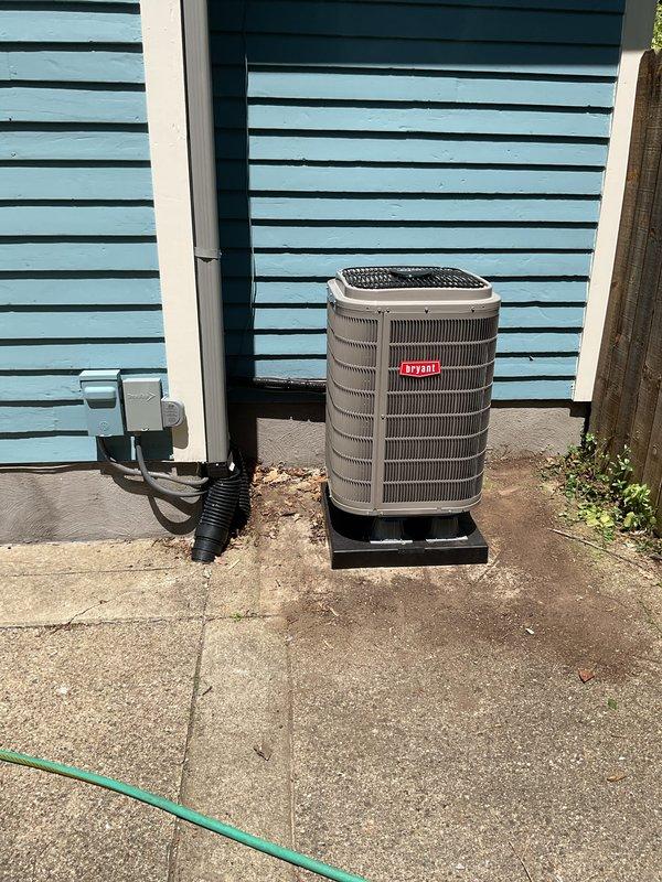 Completed installation of new Bryant heat pump system including outdoor condenser unit and indoor air handler. Outdoor unit was mounted on concrete pad with proper electrical disconnect and line set installation, while indoor air handler was installed in basement mechanical room with appropriate condensate drainage and ductwork connections. All components were properly wired, refrigerant lines were connected and tested, and system was commissioned to ensure optimal heating and cooling performance.