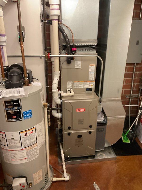 Successfully completed installation of a new Bryant HVAC system in the basement mechanical room, consisting of a high-efficiency furnace (Model CVAVA3017XMAEBAA) and air conditioning unit utilizing R-454B refrigerant. The furnace was properly positioned, leveled, and secured with all necessary condensate drainage lines, refrigerant lines, gas connections, electrical wiring, and ductwork completed to manufacturer specifications and local code requirements.