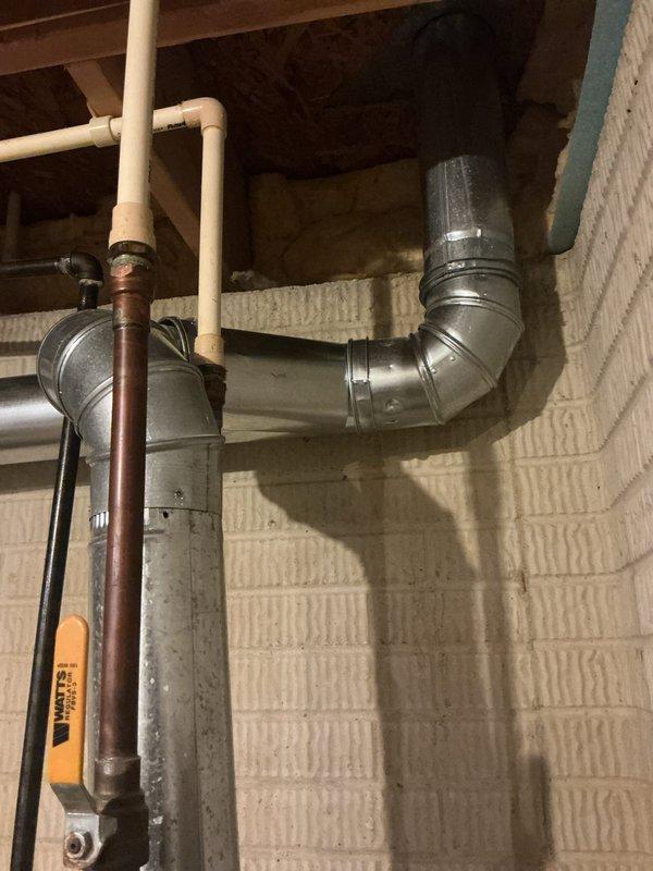 Completed full HVAC system installation including new furnace and air conditioner unit in residential basement location. Installation included proper ductwork configuration with metallic supply trunk lines and 90-degree transitions, ensuring optimal airflow distribution throughout the home. All components properly mounted, connected to existing plumbing and electrical systems, with system tested and verified operational upon completion.