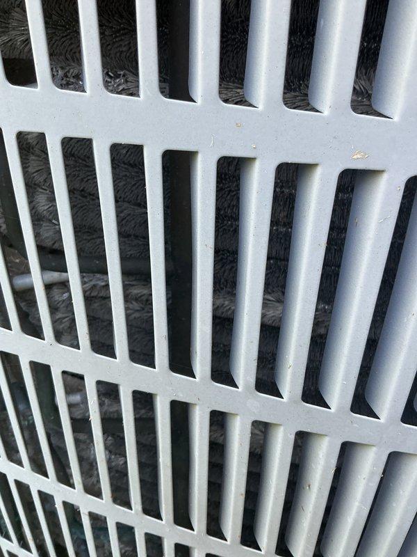 Completed comprehensive AC tune-up on residential split system, including inspection of outdoor condensing unit and indoor air return grille. Performed standard maintenance procedures, documented current system condition with photos, and provided customer with replacement unit quote as requested.