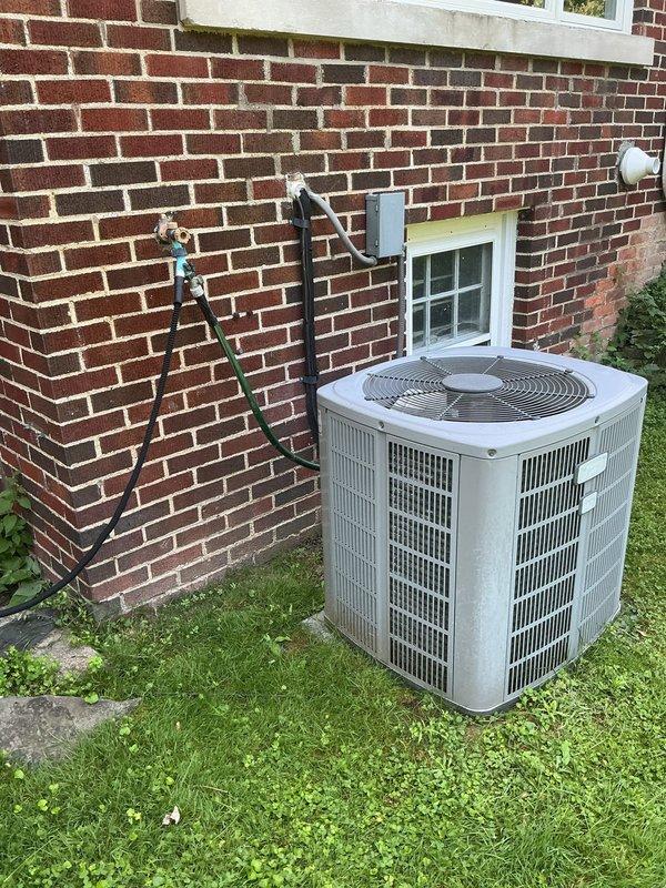Completed comprehensive AC tune-up on residential split system, including inspection of outdoor condensing unit and indoor air return grille. Performed standard maintenance procedures, documented current system condition with photos, and provided customer with replacement unit quote as requested.