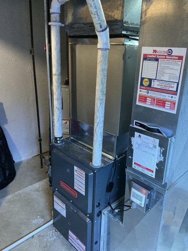 Completed installation of new air conditioning system with evaporator coil in residential utility space. System includes new air handler unit with integrated evaporator coil, refrigerant line set with properly installed service valves, and PVC condensate drain piping with trap assembly. All equipment mounted securely, refrigerant lines insulated, electrical connections completed per manufacturer specifications, and system tested for proper operation.