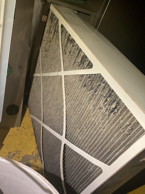 Completed comprehensive AC tune-up on outdoor condensing unit, including system inspection and filter evaluation. Replaced heavily soiled triangular air filter that exhibited significant dust accumulation and debris buildup across pleated media. Verified proper unit operation and collected payment for service renewal.