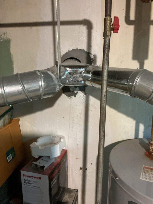 Completed full HVAC system installation including new air conditioning unit with matching evaporator coil integrated with existing Carrier furnace. Installed new ductwork with Y-junction fitting for proper airflow distribution, connected refrigerant lines using copper piping with shutoff valves, and integrated Space-Gard air cleaner for enhanced indoor air quality. All equipment properly mounted, connected, and tested for optimal performance with service financing documentation completed and identification verified on file.