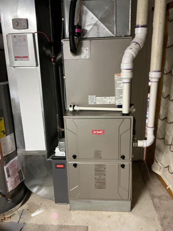 Successfully completed full HVAC system installation including new Bryant air conditioning unit and evaporator coil. Installed outdoor condenser unit on gravel pad with proper clearances, connected refrigerant lines, and integrated new A-coil with existing furnace system. Ran condensate drainage lines with PVC piping, completed all electrical connections, pressure tested refrigerant system, and verified proper operation of complete heating and cooling system.