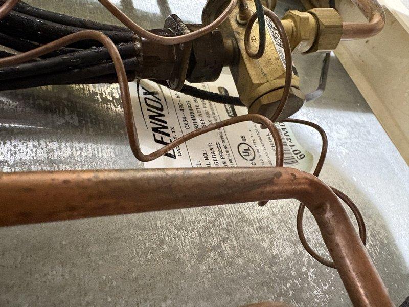 Completed comprehensive AC tune-up on 10-year-old Lennox unit operating normally. Inspected evaporator coil, refrigerant lines, and all electrical connections; verified refrigerant charge levels remained adequate since last service when system was recharged. All components tested within manufacturer specifications with no issues detected.