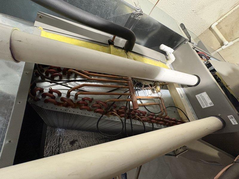 Completed comprehensive AC tune-up on 10-year-old Lennox unit operating normally. Inspected evaporator coil, refrigerant lines, and all electrical connections; verified refrigerant charge levels remained adequate since last service when system was recharged. All components tested within manufacturer specifications with no issues detected.
