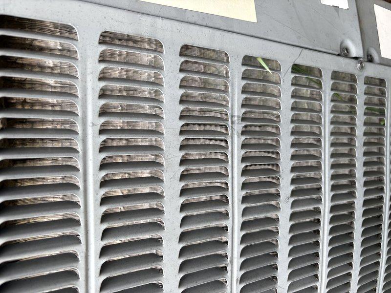Responded to no cooling complaint on residential air conditioning system. Upon inspection, found evaporator coil heavily contaminated with dust and debris buildup, significantly restricting airflow through the unit. Return air grate also showed substantial dust accumulation. Cleaned evaporator coil fins and cleared blockages to restore proper airflow and system operation. Unit tested and confirmed blowing cold air upon completion.