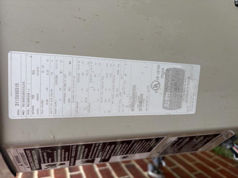 Performed comprehensive air conditioning tune-up on 5-year-old unit during high-demand cooling period. Completed full system inspection, verified manufacturer specifications on equipment nameplate, checked electrical panel and circuit breaker connections, and documented unit condition with photos. System operating properly with no issues identified.