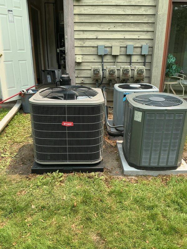 Completed full HVAC system installation including a new Bryant furnace in the utility room and Trane condensing unit positioned outdoors on a concrete pad. The indoor furnace was properly mounted with connecting ductwork and ventilation components, while the outdoor unit was set on a level concrete base with appropriate clearances from the structure. All refrigerant lines, electrical connections, and drainage piping were installed to manufacturer specifications, and both heating and cooling systems were tested for proper operation upon completion.