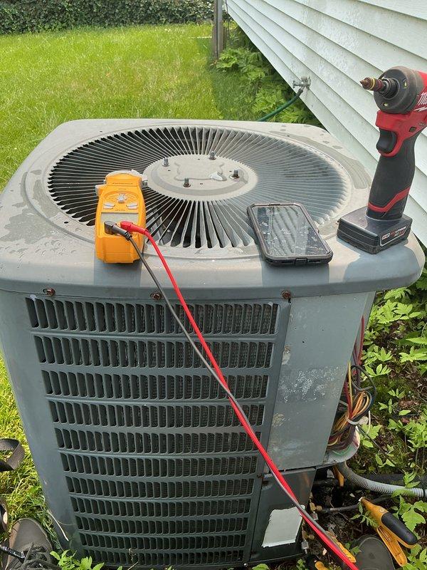 Completed comprehensive air conditioning tune-up on outdoor condenser unit, performing standard preventive maintenance procedures including electrical testing with multimeter, component inspection, and system diagnostics. Collected payment for annual maintenance renewal and rescheduled follow-up appointment for continued service coverage.