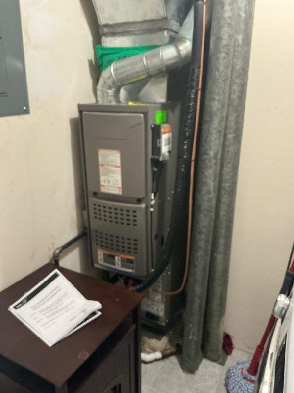 Completed installation of new Bryant air conditioning system including outdoor condensing unit and indoor evaporator coil. Outdoor unit was positioned on platform with proper electrical disconnect and conduit installation per code requirements. Indoor evaporator coil was installed atop existing furnace in utility space with refrigerant lines and flexible ductwork properly connected. System was fully charged, tested for proper operation, and all components verified functional with no leaks detected.