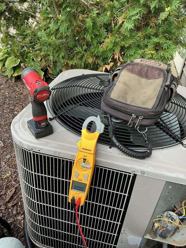 Completed comprehensive air conditioning tune-up on outdoor condensing unit, performing standard preventive maintenance procedures including system performance testing with digital multimeter and electrical diagnostics. Updated equipment information for service records as unit details were previously unavailable in system.