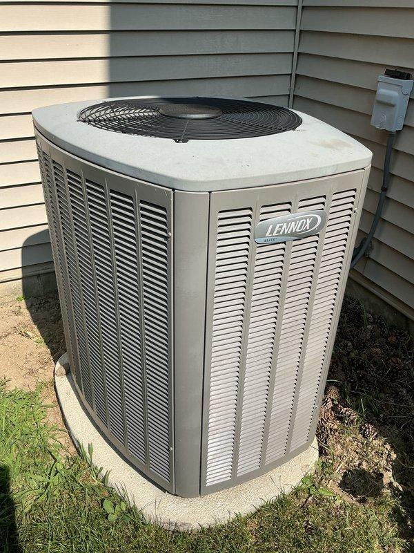 Completed comprehensive AC tune-up service on residential Lennox condensing unit as part of membership renewal. Performed standard preventive maintenance including system inspection, operational testing, and documentation of equipment condition. Notable findings include significant rust-colored oxidation and debris accumulation on lower evaporator coil fins requiring attention, while outdoor condensing unit and associated components remain in operational condition with normal weathering for age.