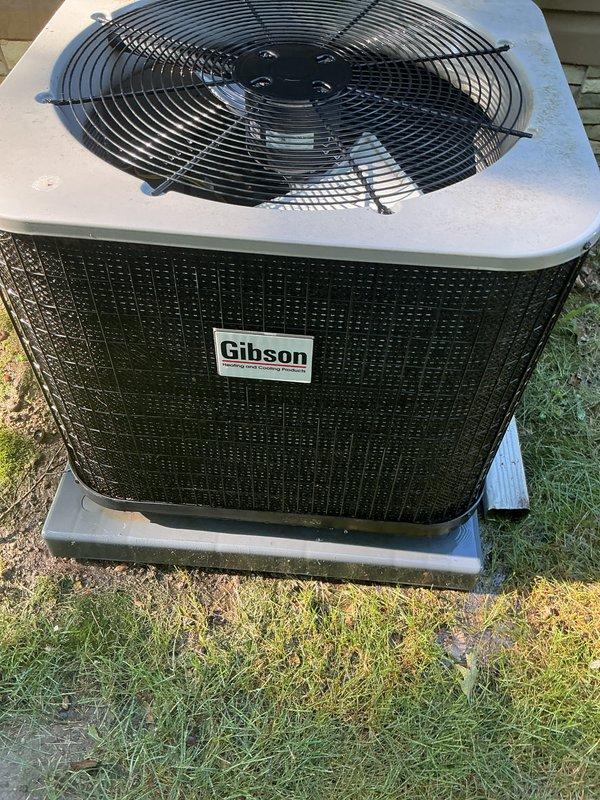 Completed comprehensive AC tune-up on Gibson outdoor condenser unit. Performed standard preventative maintenance including inspection of all major components, cleaning of condenser coils and grille surfaces to remove accumulated debris and dirt buildup, verification of proper fan operation and guard integrity, and confirmation of unit functionality. System operating within normal parameters upon completion of service.