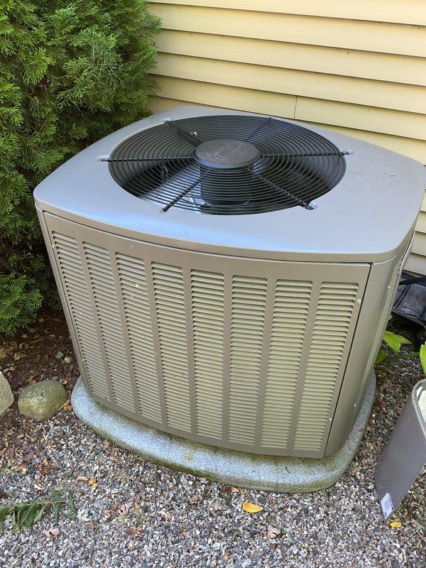 Completed routine air conditioning tune-up on a five-year-old outdoor condensing unit. Performed comprehensive system inspection, cleaned condenser coils, checked refrigerant levels and pressures, verified electrical connections, tested capacitor performance, and confirmed proper fan motor operation. Unit operating efficiently with no issues identified; all components functioning within manufacturer specifications.