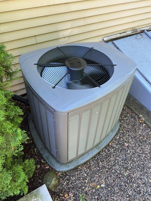 Completed routine air conditioning tune-up on a five-year-old outdoor condensing unit. Performed comprehensive system inspection, cleaned condenser coils, checked refrigerant levels and pressures, verified electrical connections, tested capacitor performance, and confirmed proper fan motor operation. Unit operating efficiently with no issues identified; all components functioning within manufacturer specifications.