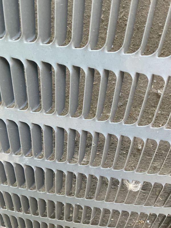 Completed scheduled air conditioning tune-up and preventative maintenance on outdoor condensing unit. Inspected condenser coil and found moderate accumulation of dirt, dust, and debris between fins, which was documented for cleaning to restore optimal heat transfer efficiency. Unit operational in cooling mode upon completion of service visit.