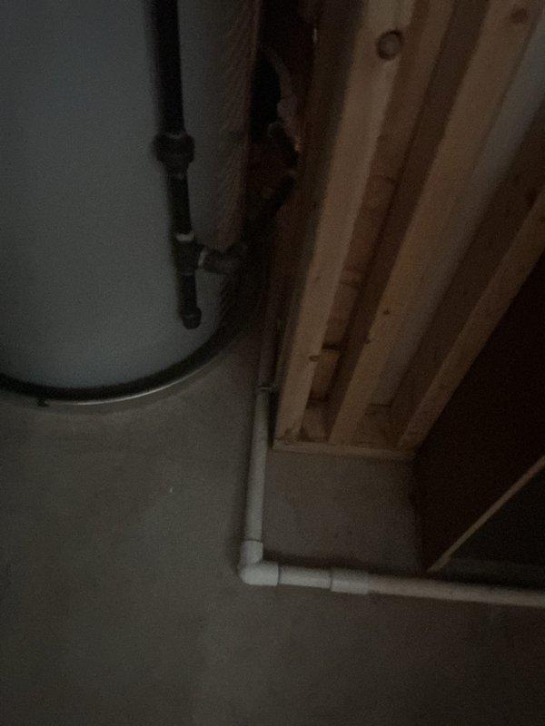Completed callback inspection for recently installed 7.23 SEER dehumidification system and HVAC unit that developed unusual operational noises during extreme heat conditions. Verified proper installation of PVC condensate drainage system with appropriate pitch and connections; documented exterior wall penetrations and interior plumbing configuration. Customer awaiting power vent water heater installation to complete full system integration.