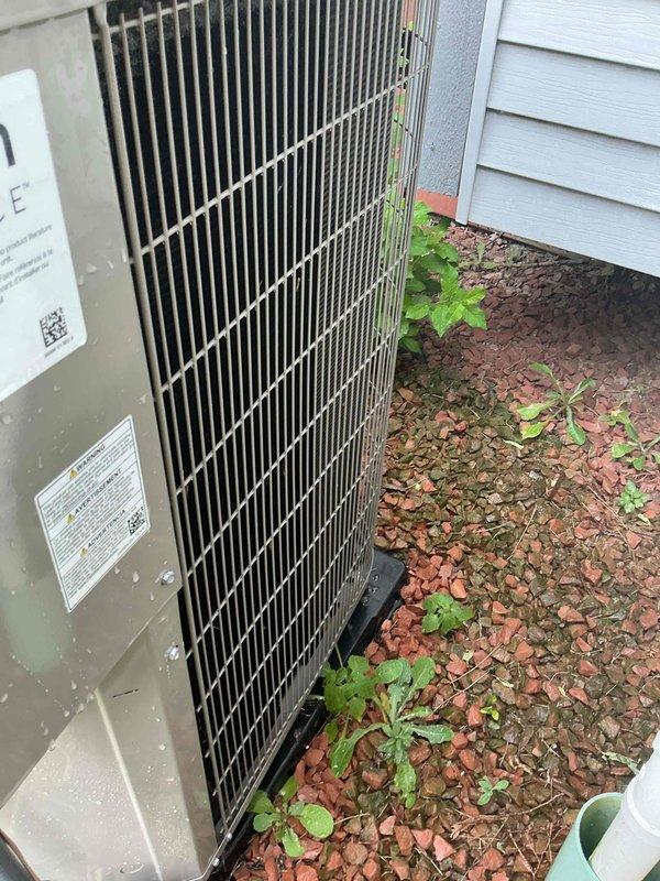 Completed installation of new Bryant air conditioning condenser unit and evaporator coil system at residential property. Unit was positioned on concrete pad with proper clearances, refrigerant lines connected and charged to manufacturer specifications, electrical connections completed, and system tested to verify optimal cooling performance.