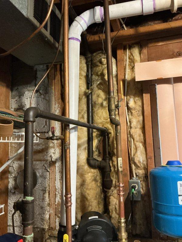 Installed new Bradford White gas-fired tanked water heater in basement utility area. Connected copper supply and outlet piping to unit, integrated existing plumbing infrastructure including pressure tank and circulation pump system. Verified all gas connections, water connections, temperature and pressure relief valve operation, and proper venting per manufacturer specifications and local code requirements.
