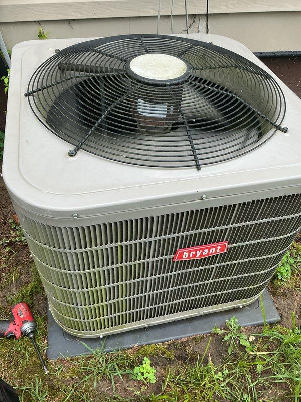 Completed scheduled air conditioning tune-up on Bryant outdoor condensing unit. Performed comprehensive system inspection, cleaned condenser coils showing algae and pollen accumulation on fins, verified proper fan operation and airflow, and confirmed unit returned to optimal cooling performance.
