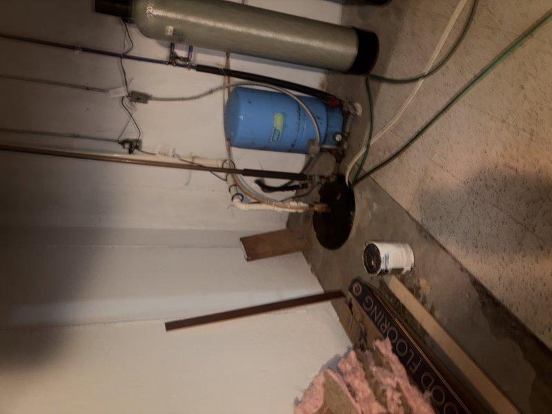 Responded to service call for air conditioning system not maintaining setpoint temperature, with indoor temperature reading 6 degrees above thermostat setting. Performed diagnostic evaluation of HVAC system and associated components in basement mechanical area. Documented existing conditions of water treatment equipment, ductwork, and utility room layout for service records.