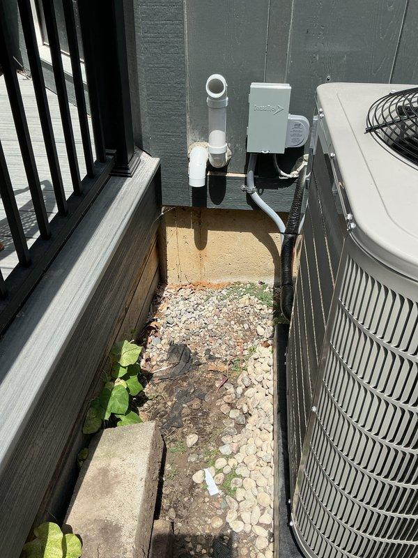 Completed full HVAC system installation including new furnace, air conditioner, and water heater at residential property. All equipment installed to manufacturer specifications with proper venting, condensate drainage, and electrical connections. Outdoor condensing unit mounted on concrete pad with appropriate clearances, PVC vent piping routed through exterior wall, and all refrigerant lines properly insulated and secured. System tested and operational upon completion with all required documentation provided.