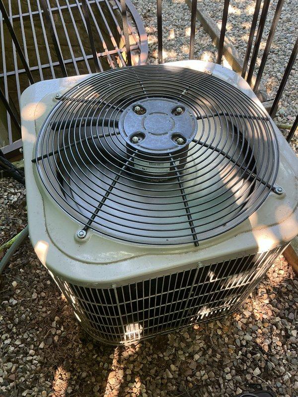 Completed comprehensive multi-system tune-up service on air conditioning unit and water heater. Performed standard preventive maintenance procedures on outdoor condenser unit, including inspection of fan motor assembly, verification of proper airflow through louvered panels, and assessment of overall system operation. Unit found in functional condition with normal signs of outdoor weathering; all components operating within acceptable parameters.