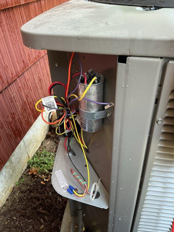 Completed comprehensive air conditioning tune-up on residential outdoor condensing unit. Performed full system inspection including electrical connections, capacitor testing, and verification of proper component operation. Collected payment for service renewal and documented equipment condition with detailed photographs showing unit exterior, electrical compartment, and internal wiring configuration.