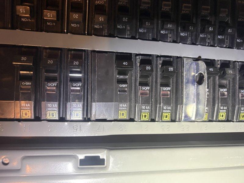 Responded to service call for 4-year-old Lennox air conditioning unit repeatedly tripping the circuit breaker. Inspected electrical panel and circuit breakers, identifying signs of wear and potential overheating on the dedicated AC breaker. Documented panel condition and breaker configuration for diagnostic purposes and recommended repairs to resolve the electrical fault causing the nuisance tripping.