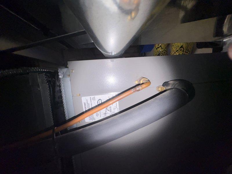 Completed comprehensive tune-up and maintenance on 15-year-old residential air conditioning system that had not been serviced in 5 years. Inspected attic-mounted air handler, refrigerant lines, and electrical components; assessed ground-level equipment including condensate drain system with dual shutoff valves and flexible ductwork connections. Addressed customer concern regarding increased operational noise levels; system confirmed operational with all components functioning properly at time of service.