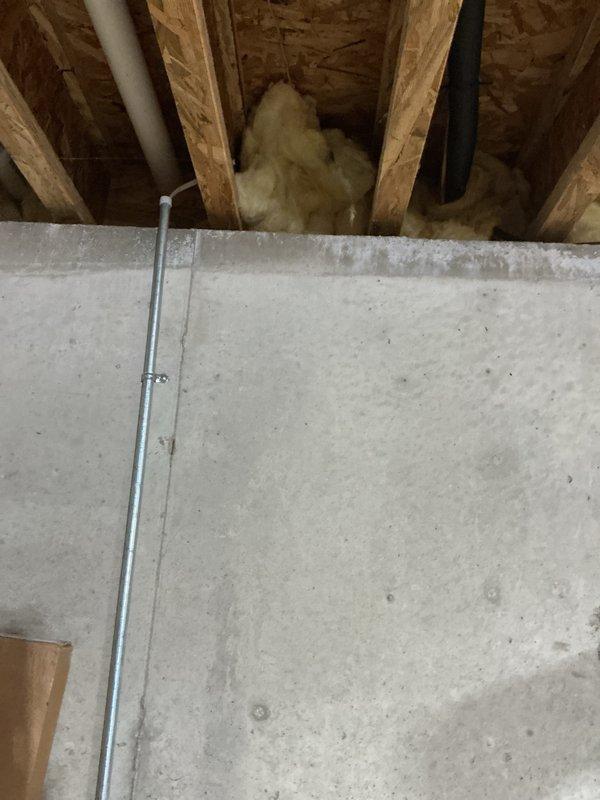 Completed installation of new air conditioning system in residential property. Installed indoor air handler unit in basement utility area with proper drainage connections using PVC piping and condensate discharge line. Ran refrigerant lineset through wall penetration to outdoor unit location. Secured electrical conduit and wiring throughout installation per code requirements. Connected ductwork to new air handler with proper sealing at all joints. Verified all mechanical, electrical, and refrigerant connections were properly installed and secured. System tested and operational upon completion.