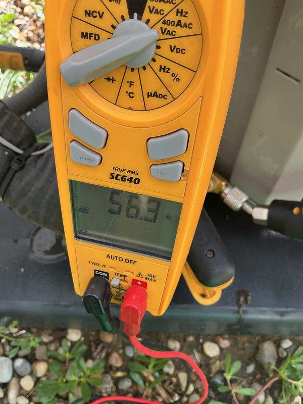 Responded to service call for Bryant air conditioning unit not cooling properly despite recent tune-up in May. Performed diagnostic testing with digital multimeter on outdoor condenser unit, measuring electrical values at 56.7 (likely voltage or capacitance reading). Identified issue requiring repair under parts warranty coverage. Coordinated access with designated contact and confirmed authorization for necessary repairs with system owner prior to completing work.