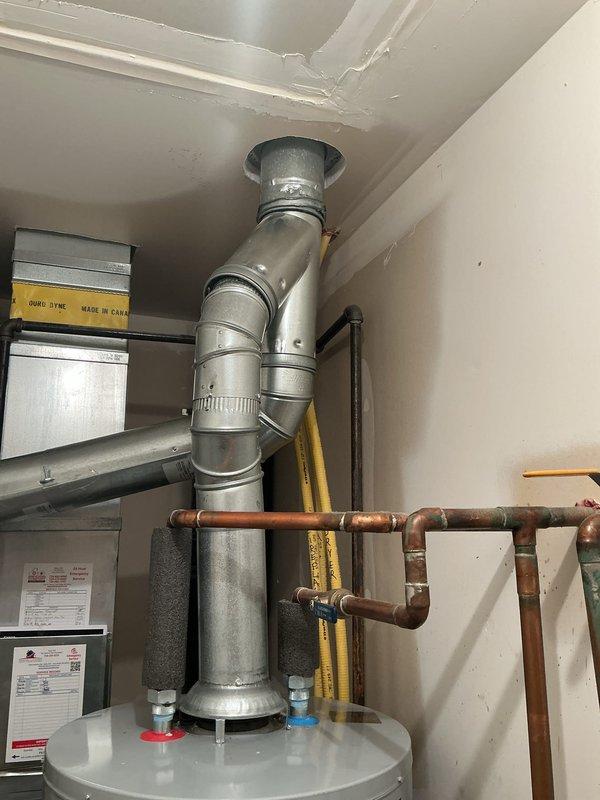 Completed full HVAC system installation including new Bryant furnace and air conditioning unit in residential utility space. Installed and properly vented furnace with connection to existing ductwork, established gas line connections with yellow CSST flexible gas piping, and configured condensate drainage using white PVC piping with secure wall mounting. All equipment tested for proper operation, manufacturer specifications verified, and system commissioned successfully.