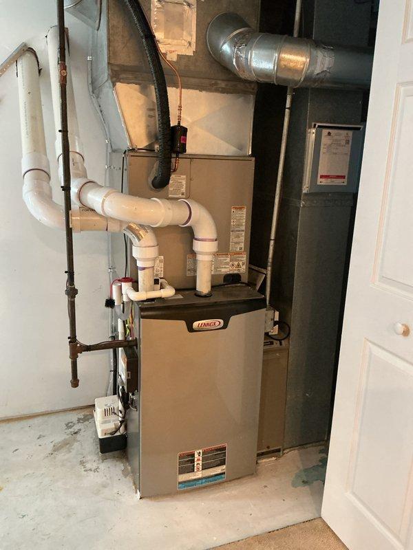 Completed installation of new Bryant air conditioning system with matching evaporator coil. Installed outdoor condenser unit on concrete pad with proper refrigerant line set and electrical disconnect, connected indoor A-coil to existing Lennox furnace with appropriate ductwork integration, evacuated and charged system to manufacturer specifications, and verified proper operation of complete cooling system.