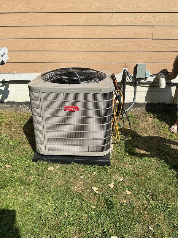 Completed installation of new Bryant air conditioning system with matching evaporator coil. Installed outdoor condenser unit on concrete pad with proper refrigerant line set and electrical disconnect, connected indoor A-coil to existing Lennox furnace with appropriate ductwork integration, evacuated and charged system to manufacturer specifications, and verified proper operation of complete cooling system.