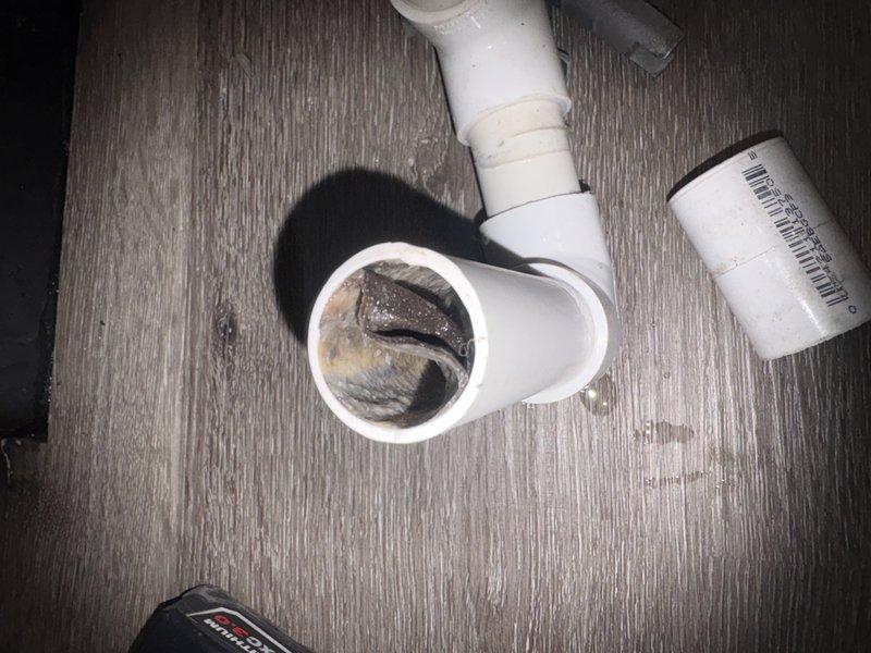 Performed comprehensive tune-up maintenance on multi-zone HVAC system serving attic and ground floor units. Conducted electrical diagnostics using clamp meter to verify proper amperage draw and system performance, inspected and evaluated evaporator coils per manufacturer specifications, and cleared drainage system including P-trap assembly which showed evidence of biological buildup requiring cleaning to ensure proper condensate flow and prevent future blockages.