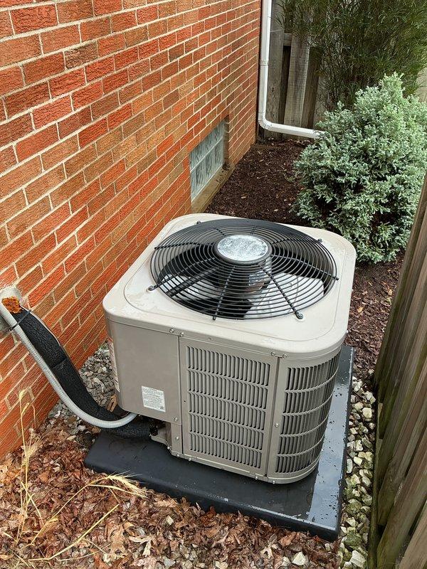 Performed routine AC maintenance and cleaning on outdoor condensing unit. Inspected condenser coils, verified proper airflow through ventilation slats, and tested electrical components using multimeter to ensure system operating within normal parameters. Unit returned to proper cooling operation upon completion of service.