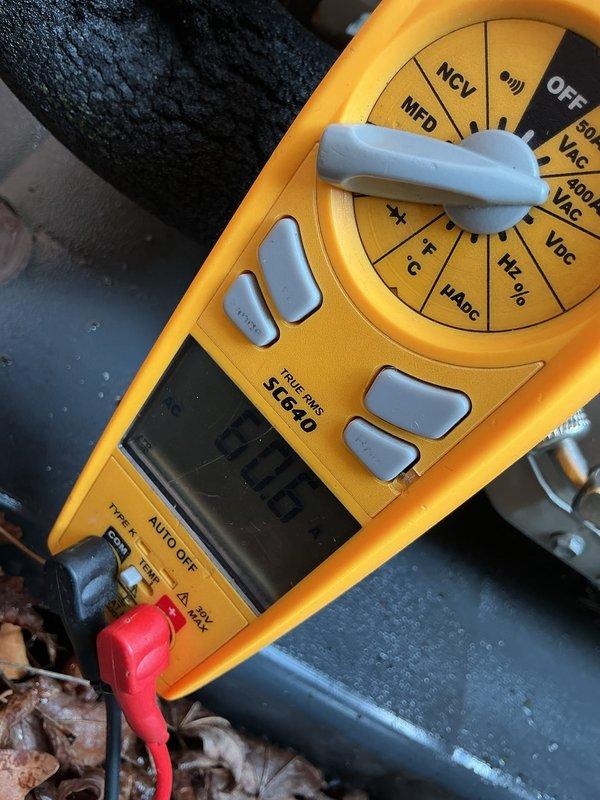 Performed routine AC maintenance and cleaning on outdoor condensing unit. Inspected condenser coils, verified proper airflow through ventilation slats, and tested electrical components using multimeter to ensure system operating within normal parameters. Unit returned to proper cooling operation upon completion of service.