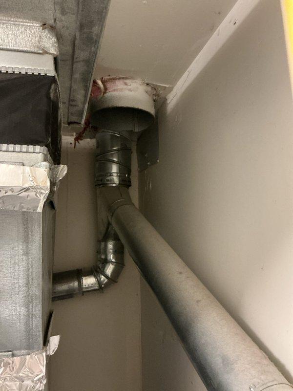 Responded to service call for water heater evaluation with customer concern regarding potential anode rod replacement. Upon arrival, performed comprehensive inspection of tanked water heater unit and associated plumbing connections. Examined water heater condition, including assessment of anode rod status, temperature and pressure relief valve, gas line connections, and overall unit performance. Inspected flexible braided gas supply line with brass fittings, verified proper connections and absence of leaks. Evaluated galvanized ductwork for exhaust venting system, noting proper installation and clearances. Documented existing conditions through photographic evidence showing mechanical room layout, water heater installation, gas line routing, and ventilation components. Observed evidence of potential moisture concerns near ceiling-mounted ductwork connections with visible staining. Provided customer with detailed findings and recommendations for necessary repairs or replacements based o